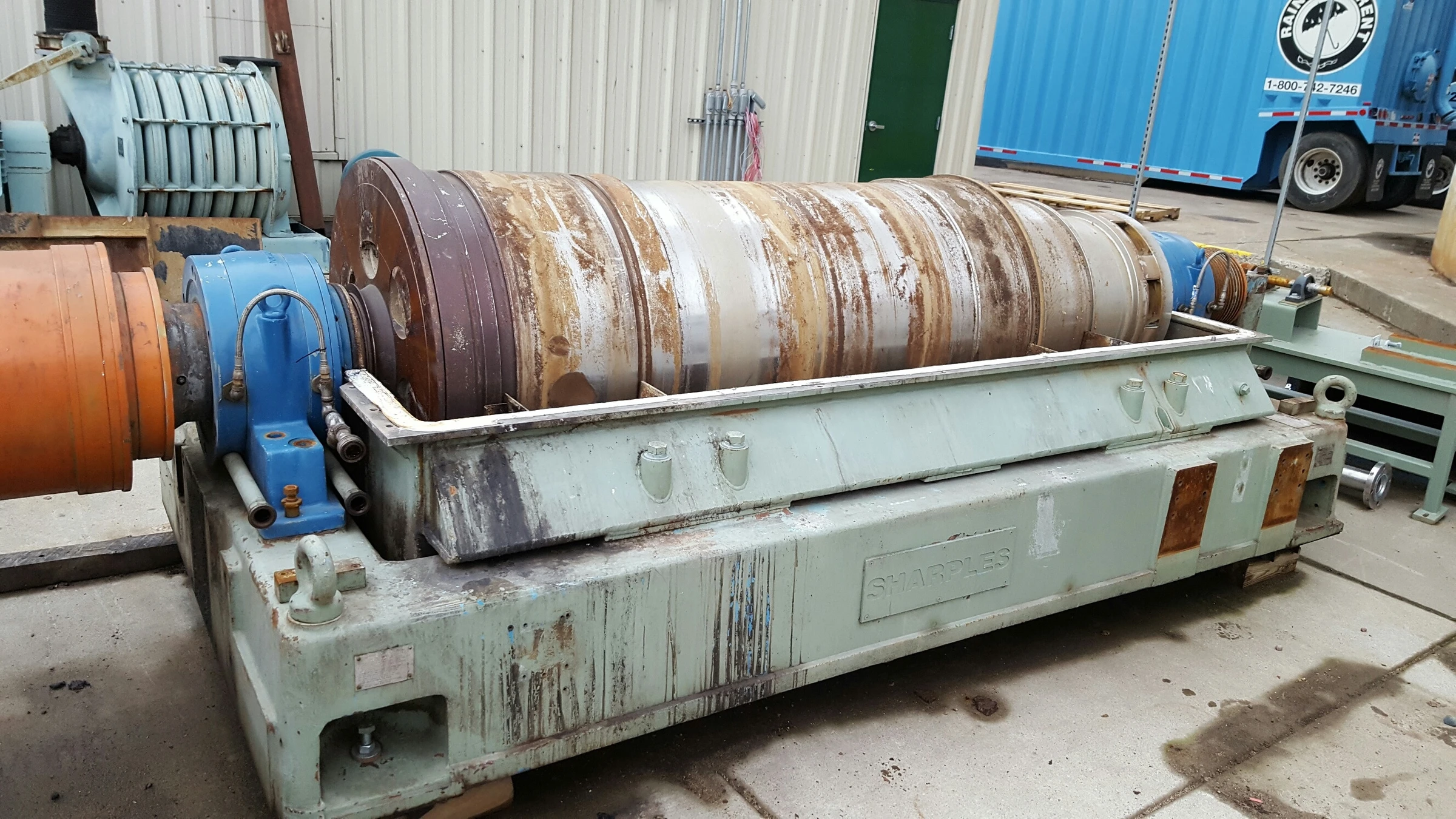 Surplus Sharples decanter centrifuge as found in the field, before Sully Enterprises refurbishment